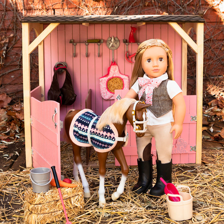 18-inch equestrian doll with blonde hair and brown eyes