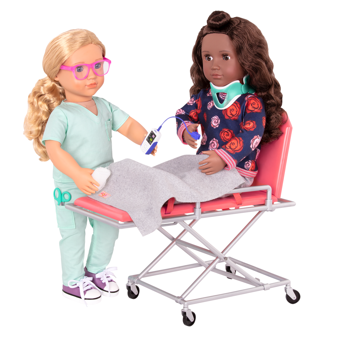 Two 46 cm dolls using ambulance gurney