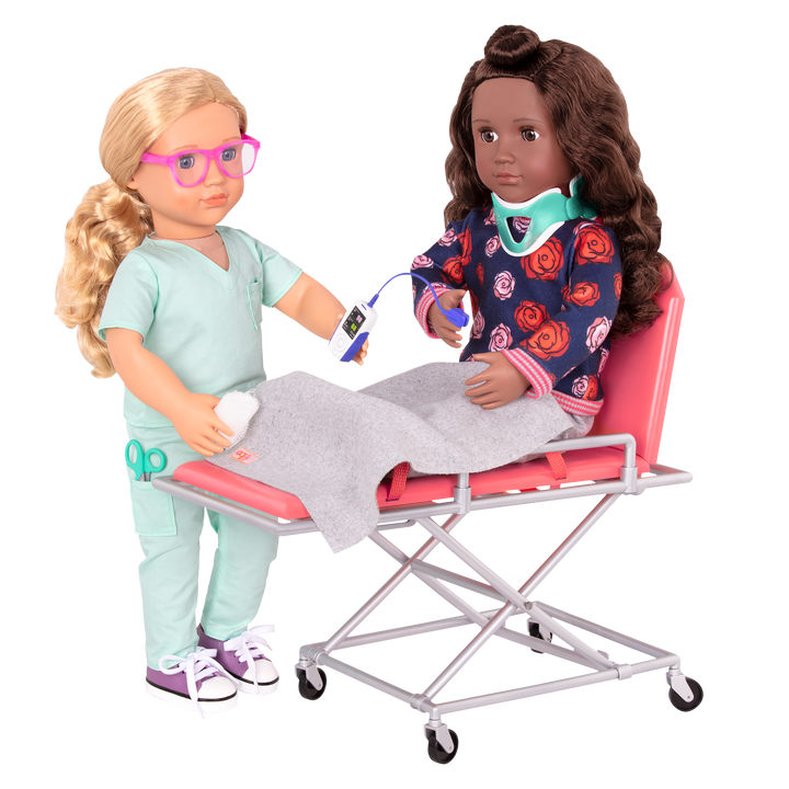 Two 46 cm dolls using ambulance gurney