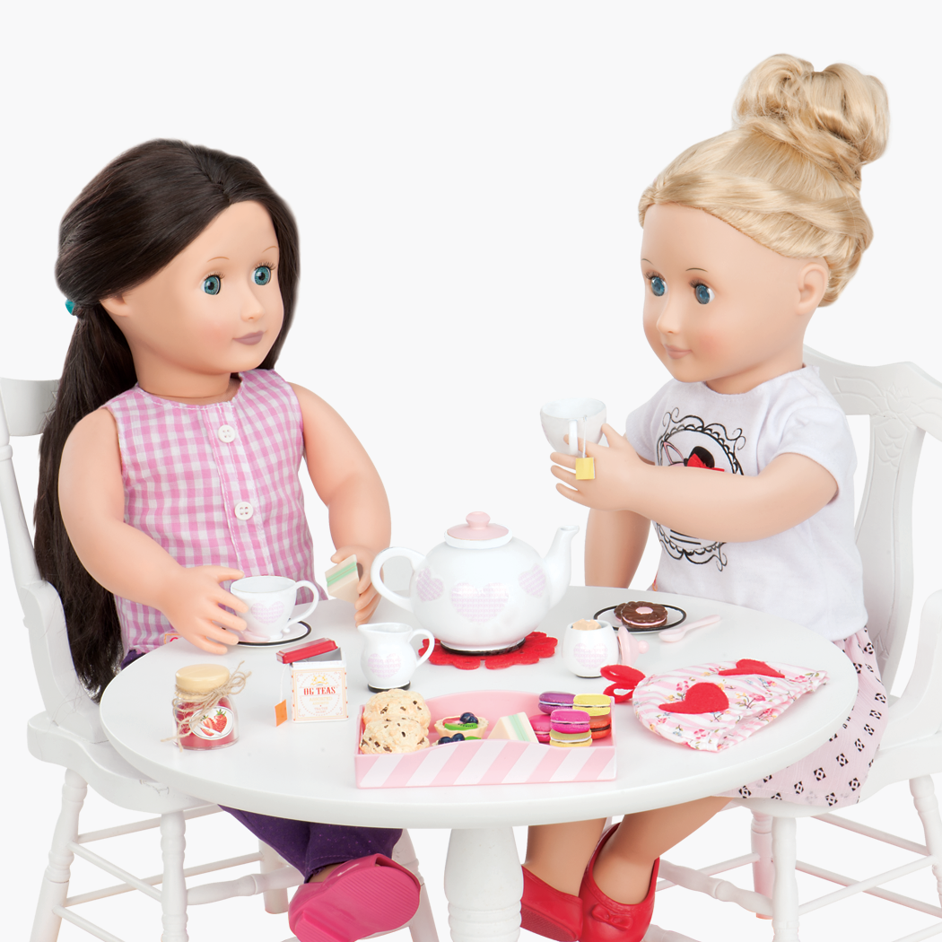 Two 18-inch dolls using tea playset